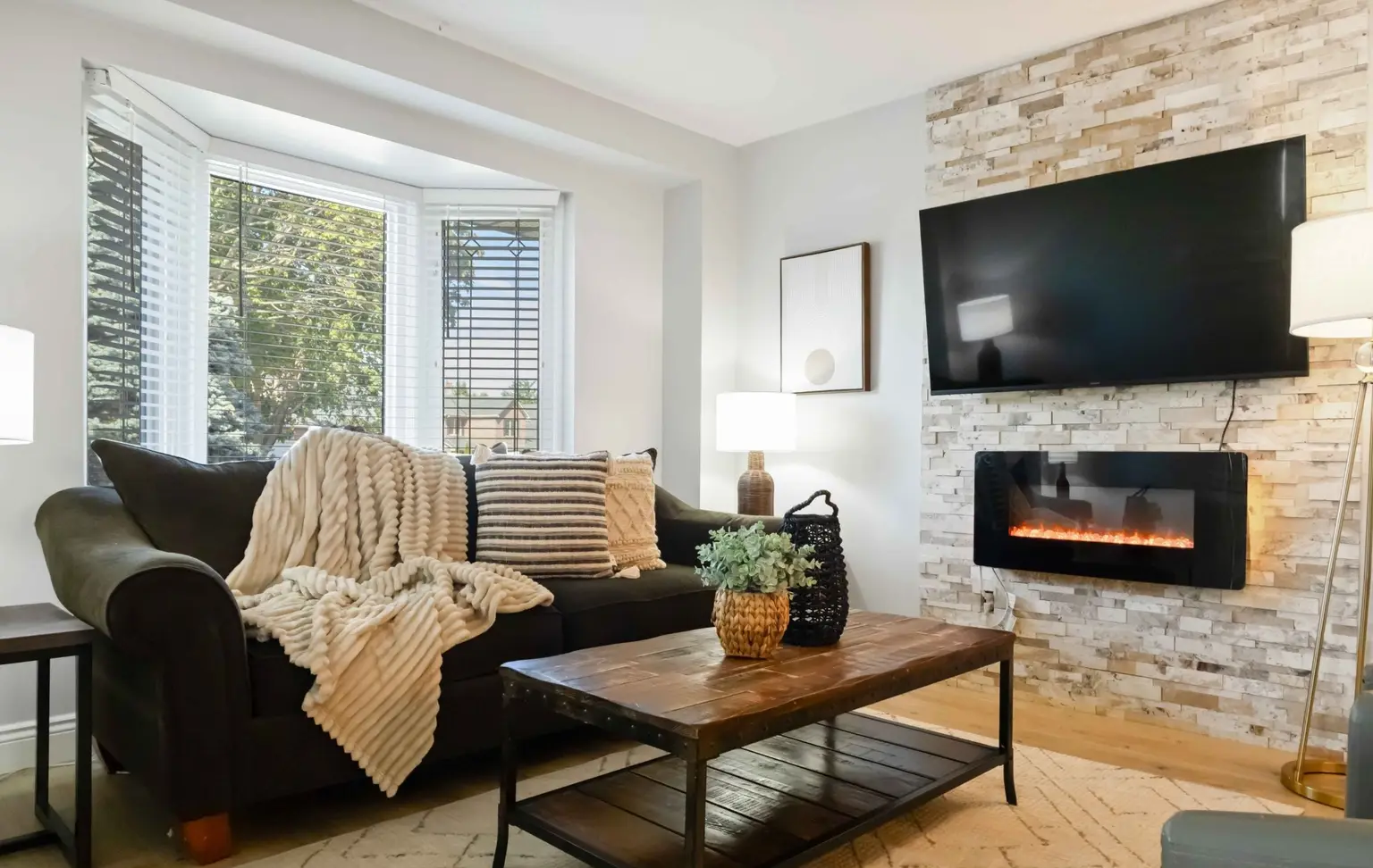 Living room with a fireplace wall