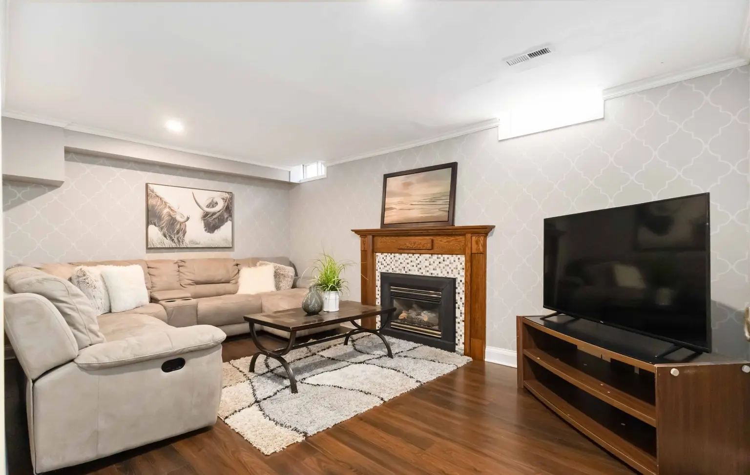 Finished basement living room with a fireplace