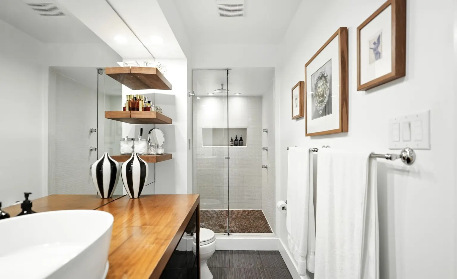 Bathroom with a freestanding tub and wood vanity