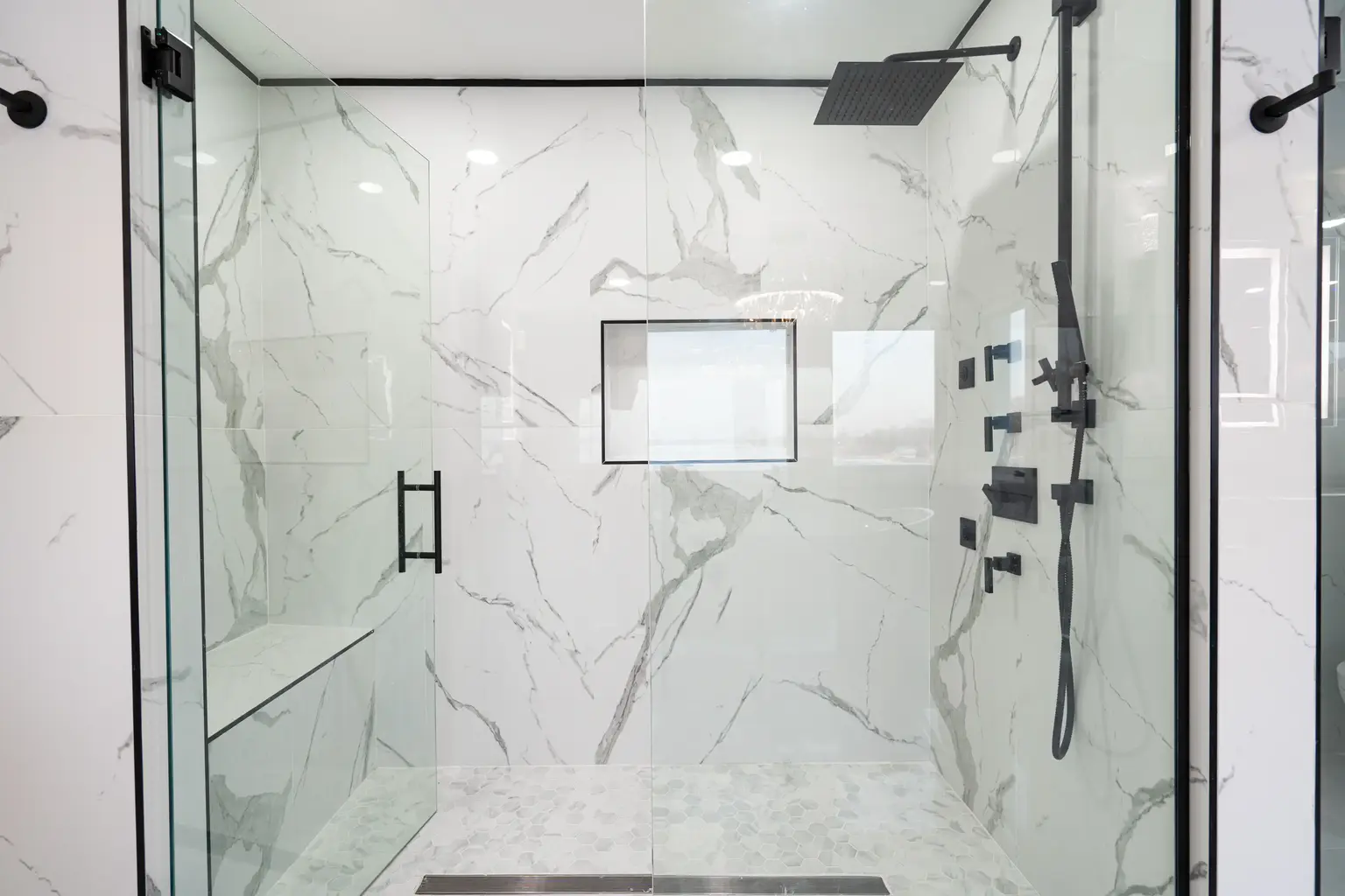 Marble shower with black fixtures
