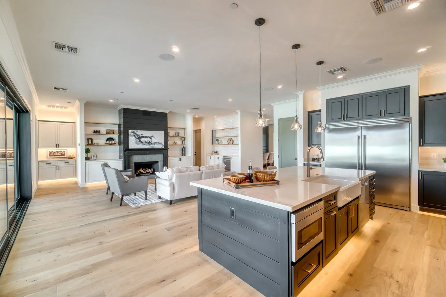 Open kitchen and living room with a dark island