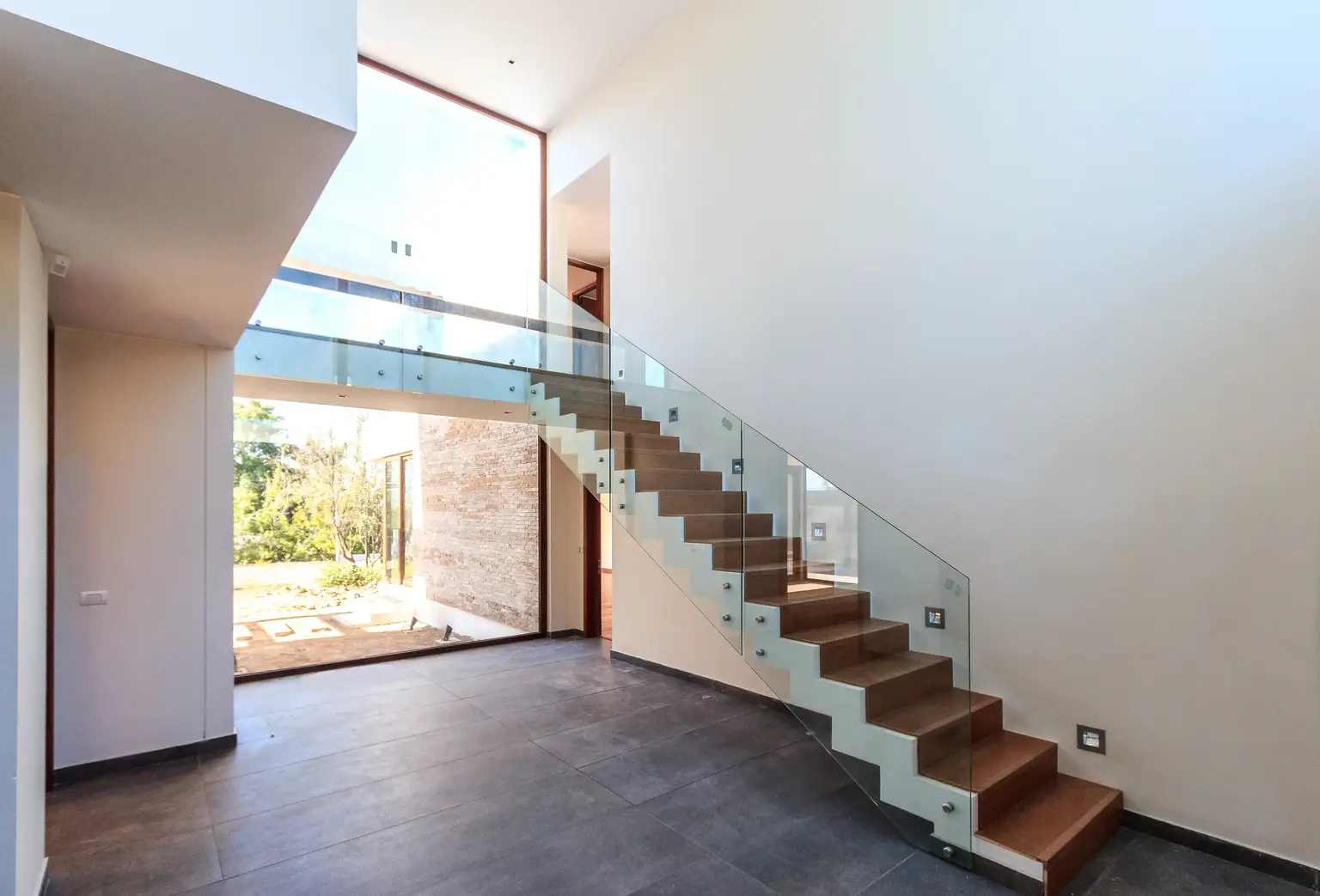 Modern floating staircase with a glass guard
