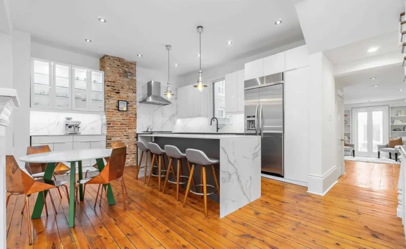 Kitchen with pendant lights and bar stools