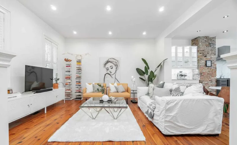 Living room with an exposed brick chimney