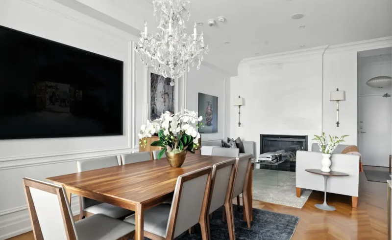 Dining table with a fireplace beyond