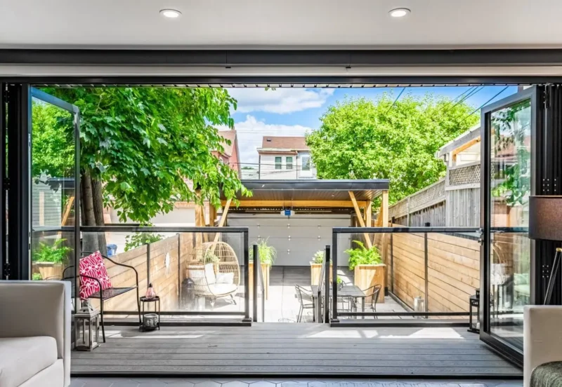 Bifold glass doors opening onto a landscaped terrace