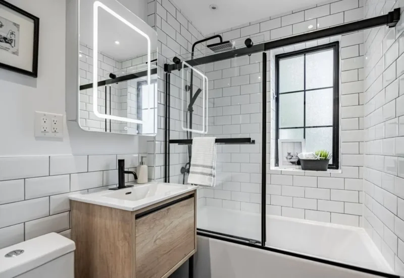 Bathroom with white subway tile and a glass shower