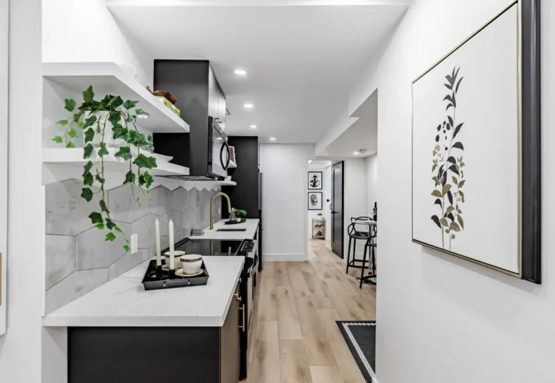 Kitchen with open shelving and black cabinetry