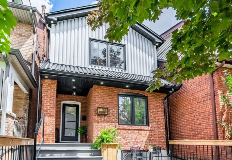 Modern brick home with dark grey siding